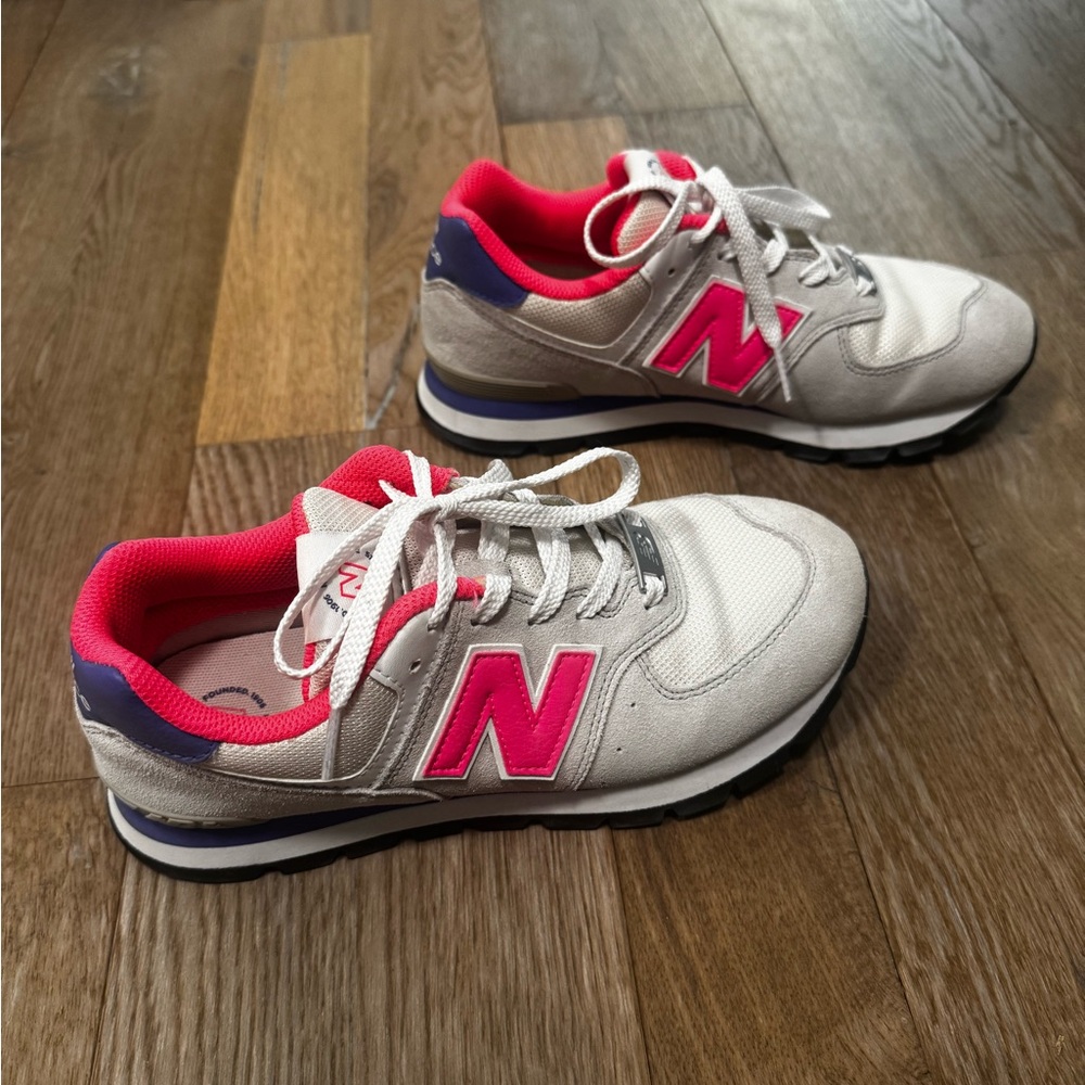 New Balance Cream, Pink, and purple sneakers.